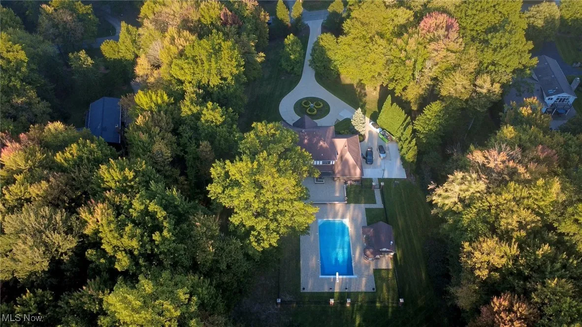 Aerial overview of property's location featuring a pool area