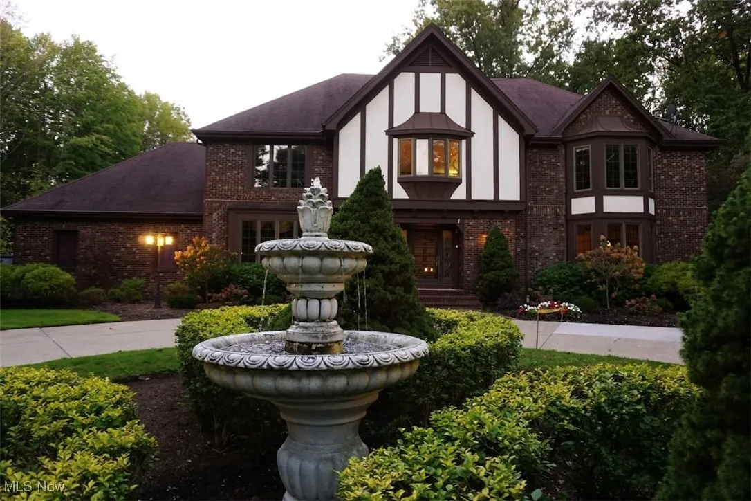 English Tudor style home with brick construction.