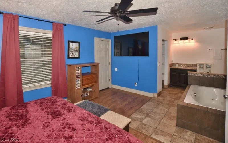 The second of the two upper floor primary bedrooms