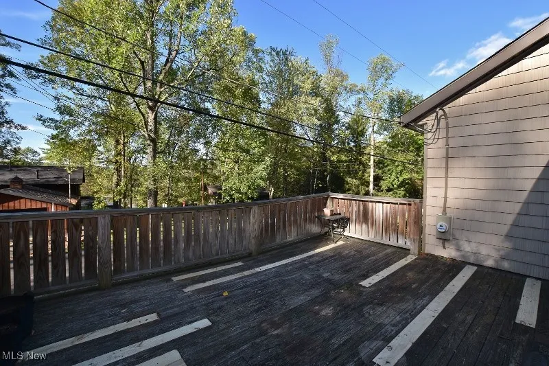 This spacious deck is accessed off the tavern room through patio doors