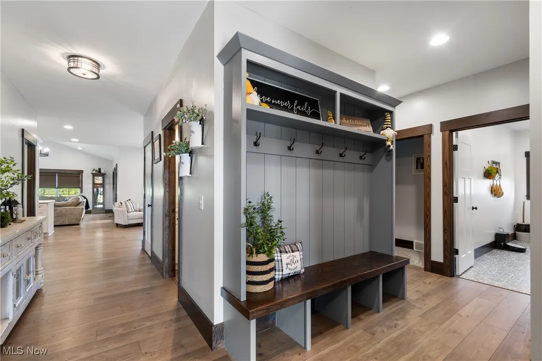 Mudroom with recessed lighting and light wood-type flooring