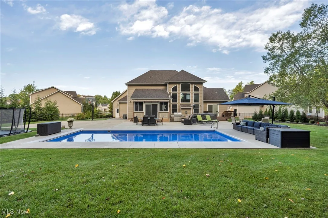 View of pool with an outdoor hangout area and a patio