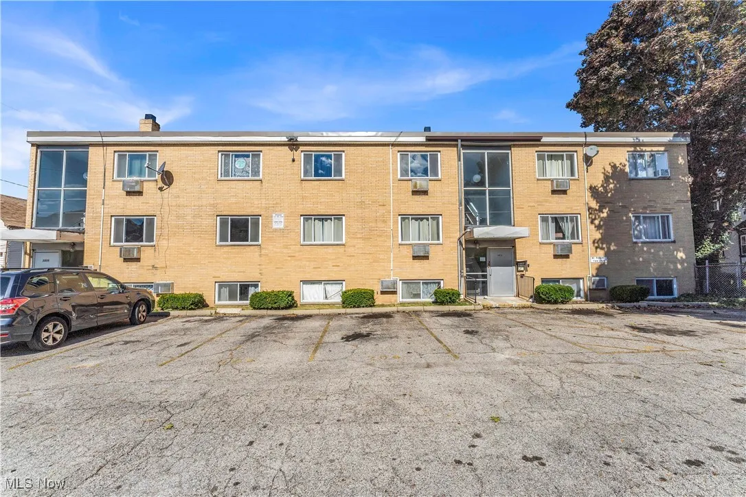 View of property with uncovered​​‌​​​​‌​​‌‌​‌‌​​​‌‌​‌​‌​‌​​​‌​​ parking