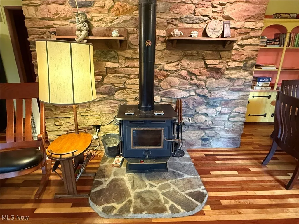 Detailed view of a wood stove and wood finished floors