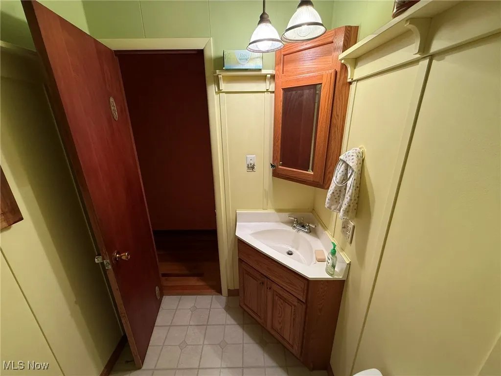 Bathroom with vanity and light tile patterned floors