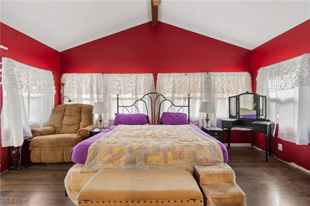 Bedroom featuring dark wood-type flooring