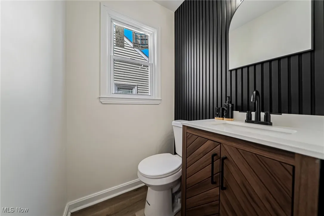 Bathroom with vanity and dark wood-type flooring
