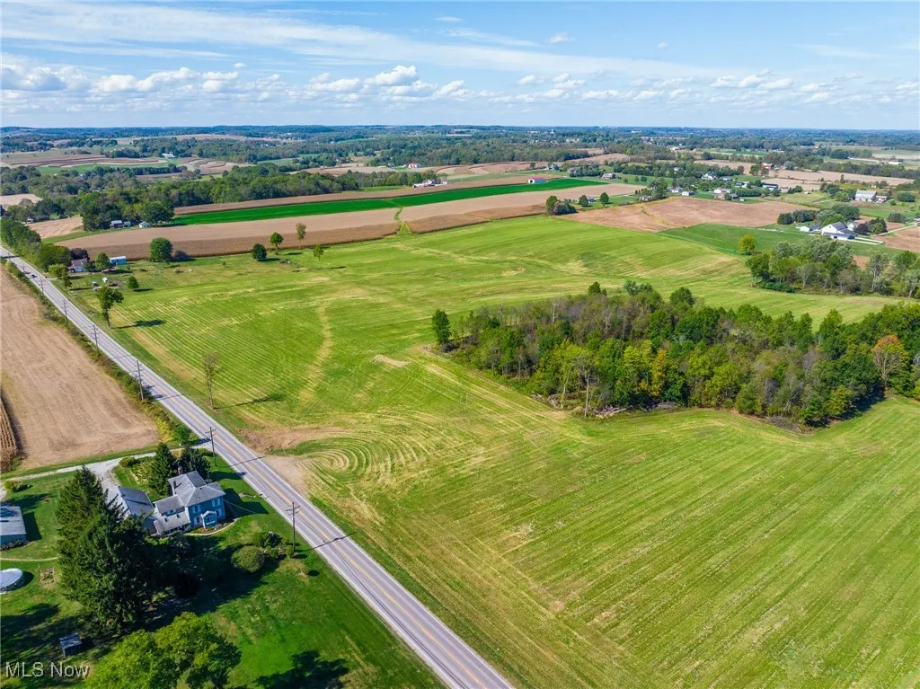 Overview of rural landscape featuring extensive farmland