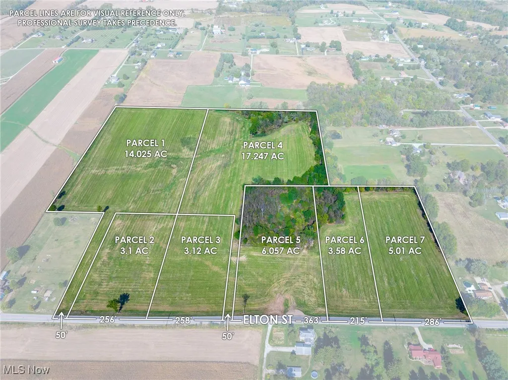 Aerial view of sparsely populated area featuring property parcel outlined