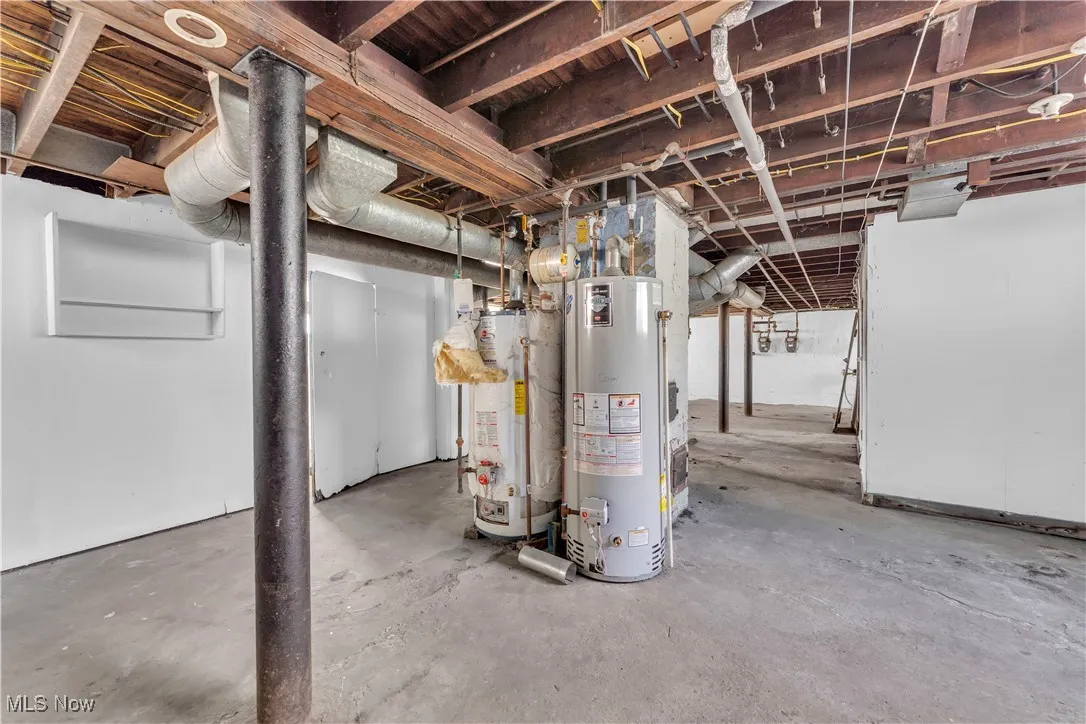 Unfinished basement with gas water heater