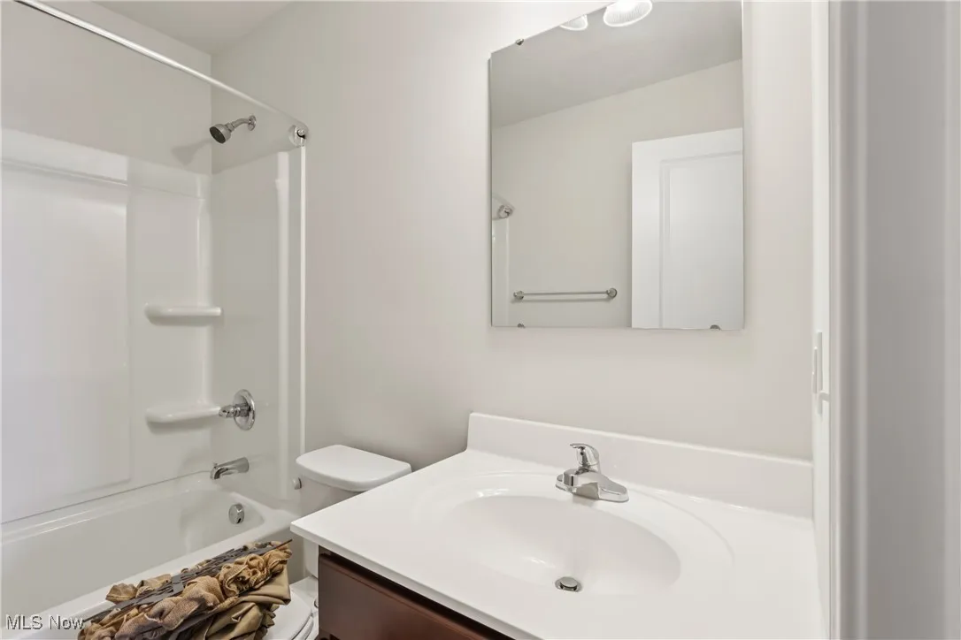 Bathroom featuring vanity and bathtub / shower combination