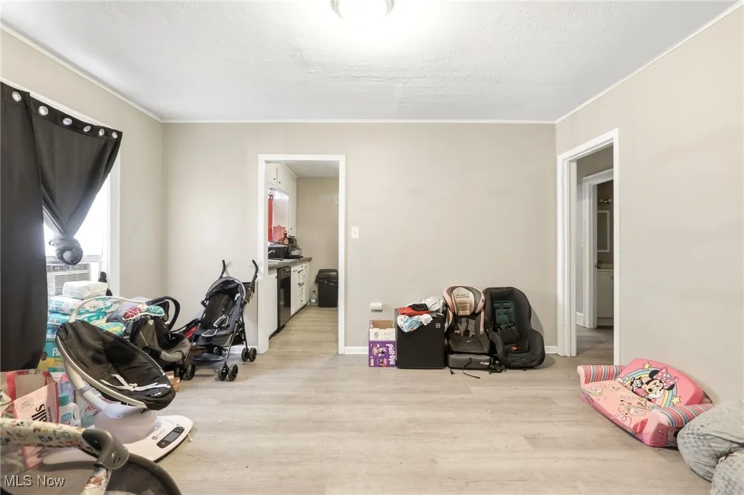 Rec room featuring wood finished floors and a textured ceiling