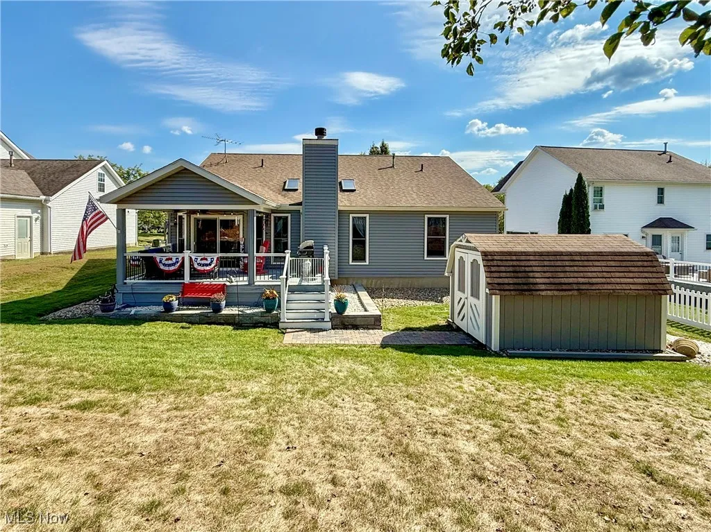 Rear of home with shed