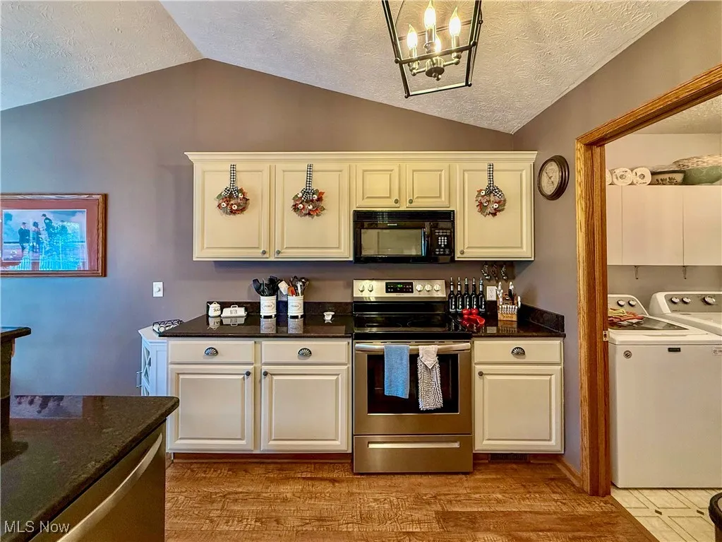 View of kitchen and laundry room to the side