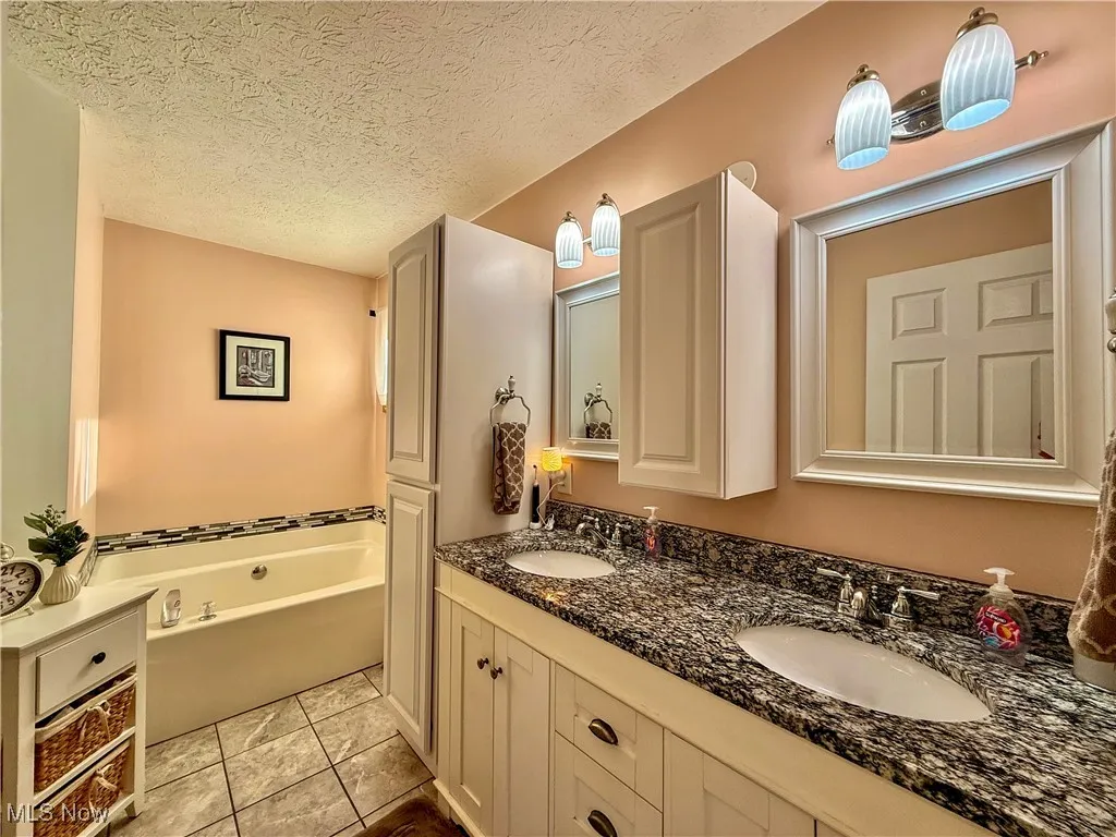 View of soaking tub in primary bathroom