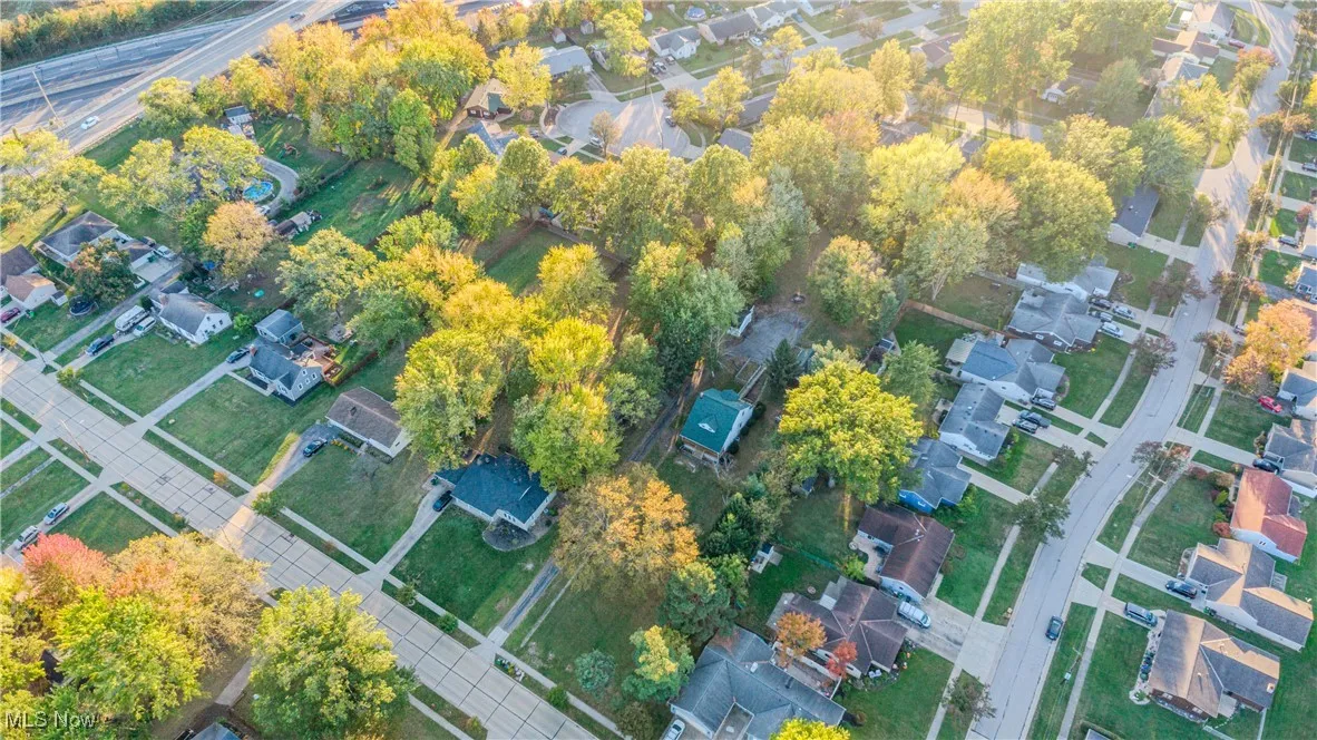Aerial overview of property's location featuring nearby suburban area