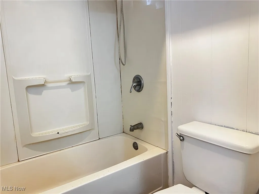 Full bath with shower / bathtub combination and toilet