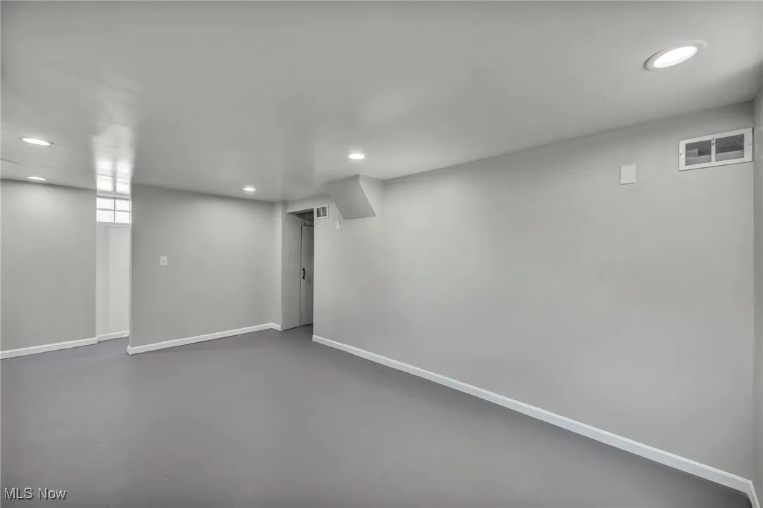 Below grade area featuring recessed lighting