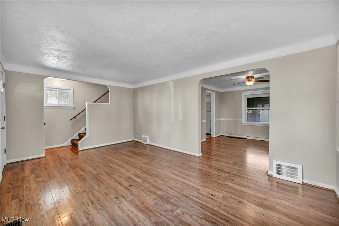 Living room with plenty of natural light hardwood floors