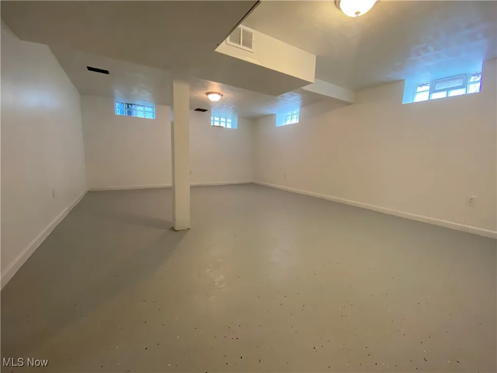 Below grade area featuring baseboards