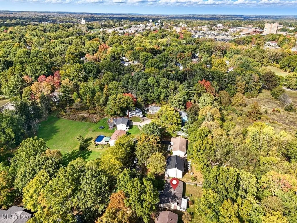 View of property location featuring a forest