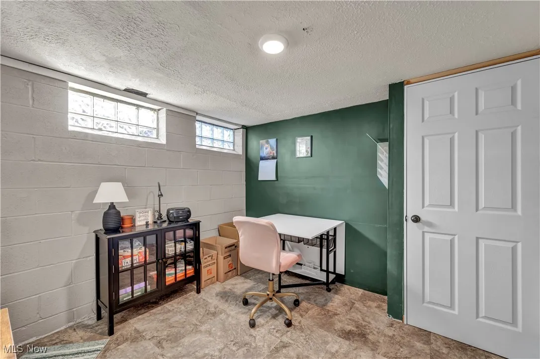Office area with a textured ceiling