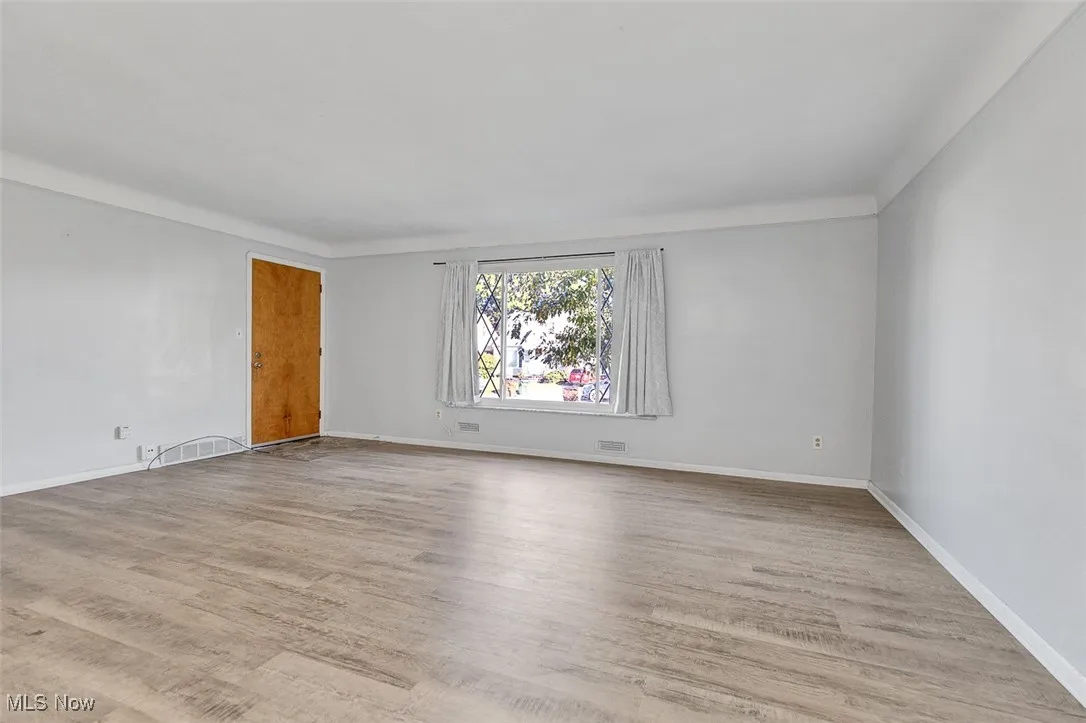 Spare room with light wood-style flooring