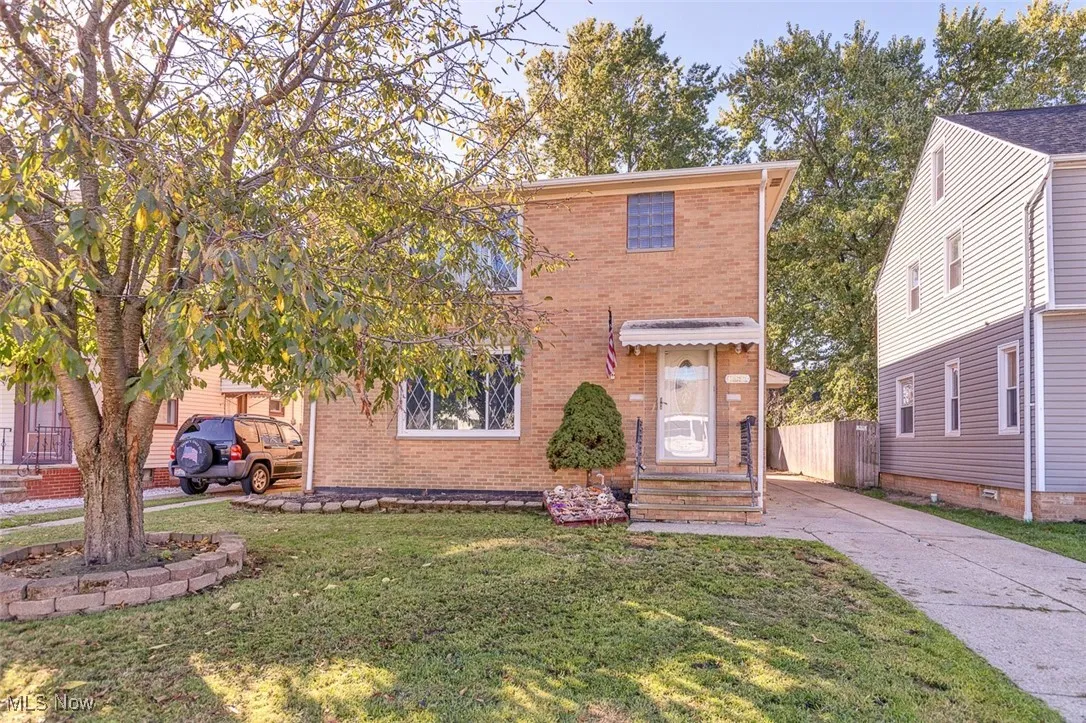 View of front of house featuring brick siding