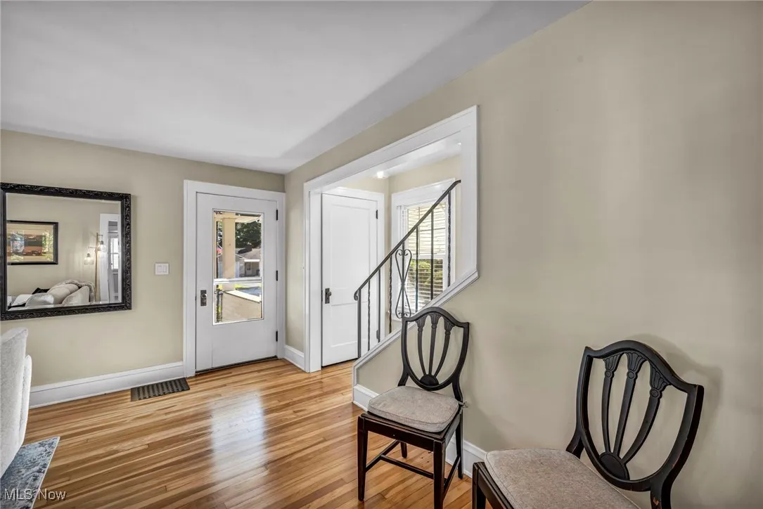 Entryway featuring  hard wood finished floors and baseboards