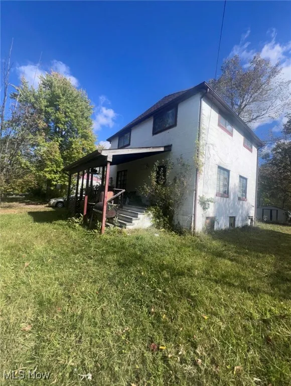View of home's exterior featuring a yard