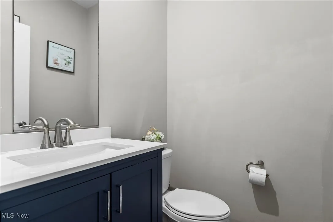 Bathroom with vanity and toilet