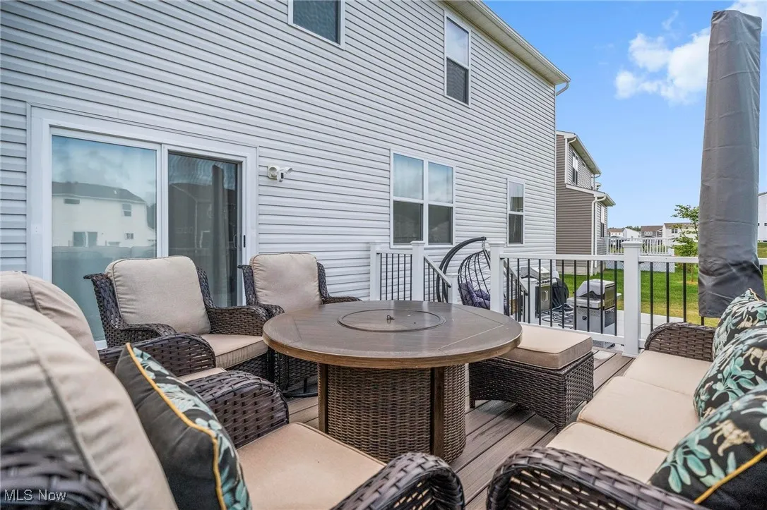Wooden deck featuring outdoor dining space