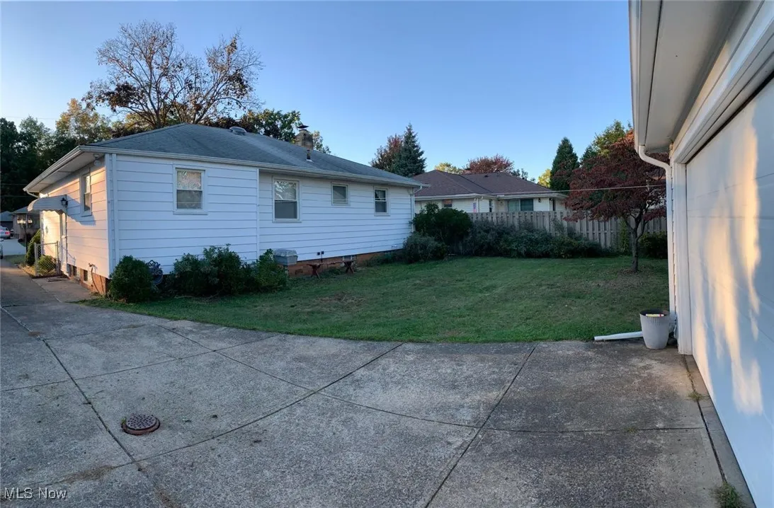 Back of property featuring a chimney