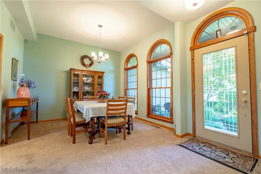 Formal Dining Room with decorative windows and high ceiling!