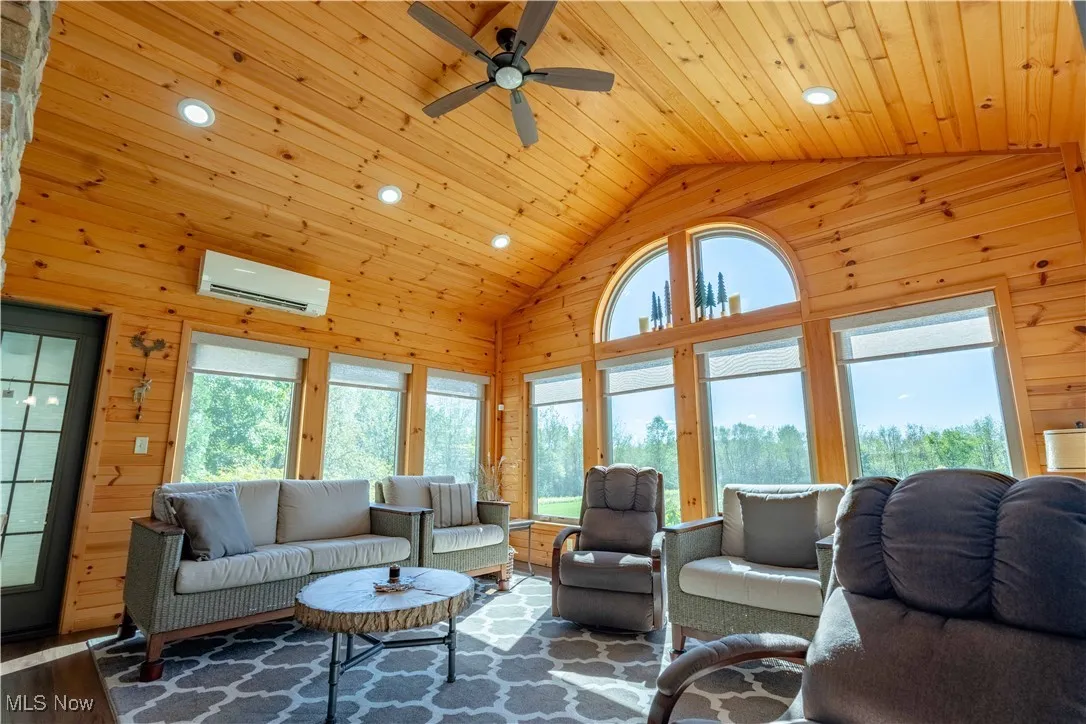 Spacious Sunroom features numerous windows allowing for all of the amazing views of nature!