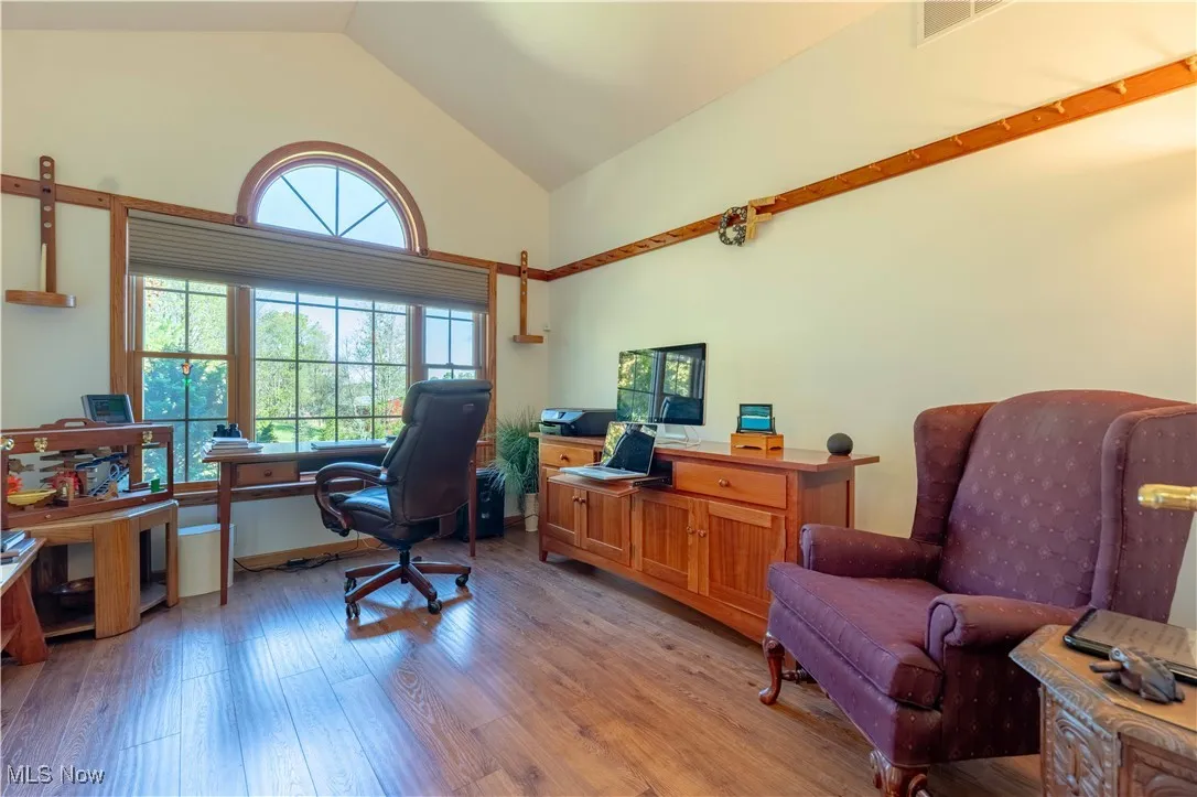 Private Office features cathedral ceiling and glass french doors.