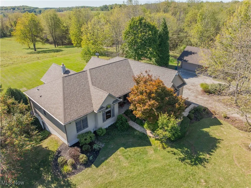 Front and side view of the home with walkout basement on the side.