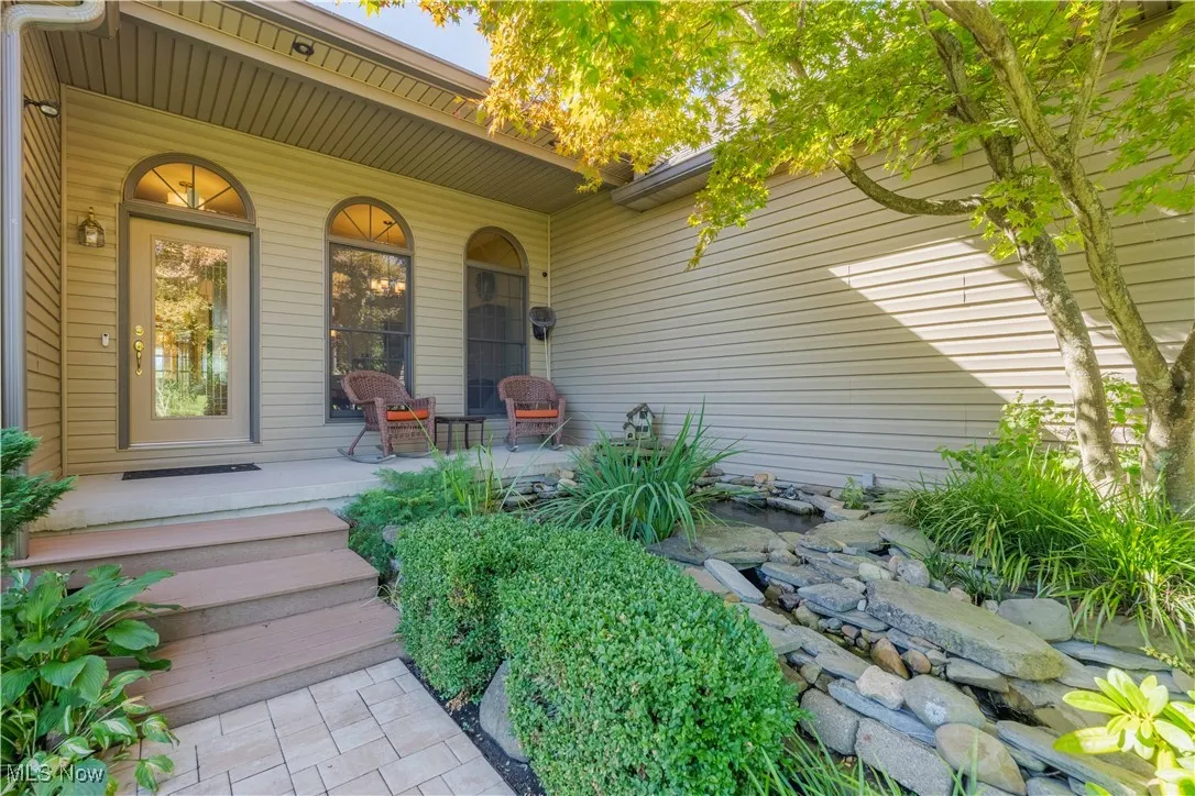 Inviting front porch with tranquil water feature!