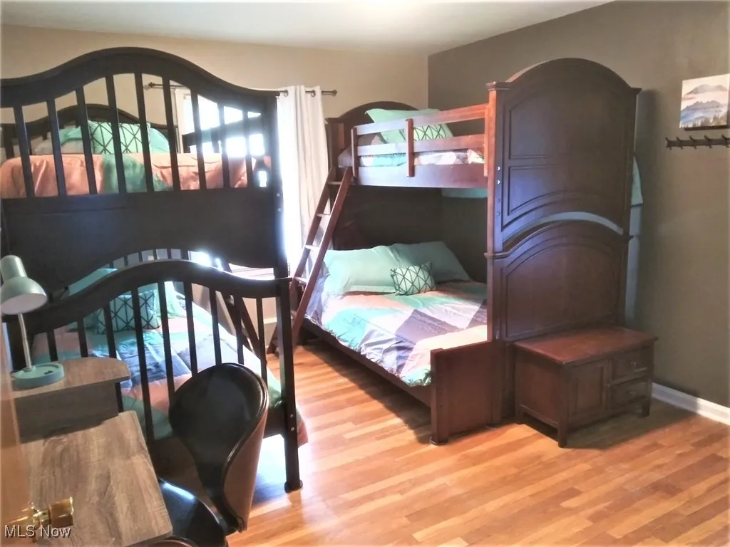 Bedroom with wood finished floors