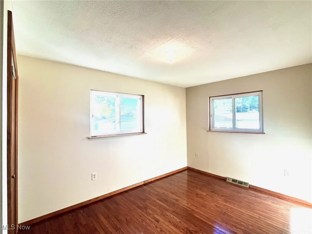 Unfurnished BR 4 with hardwood flooring