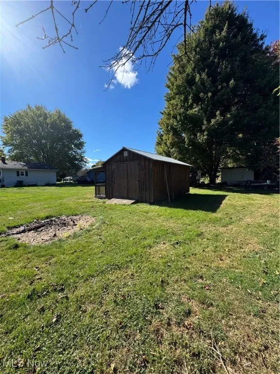 View of green lawn with an outdoor structure