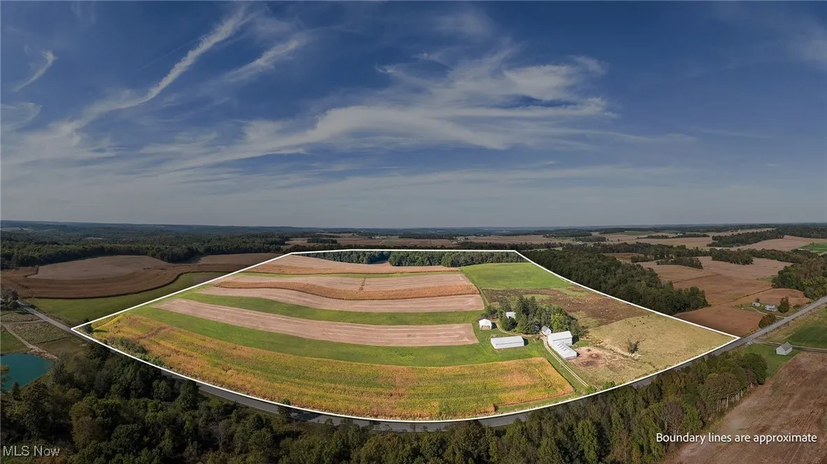 Overview of rural landscape featuring property boundaries highlighted and extensive farmland