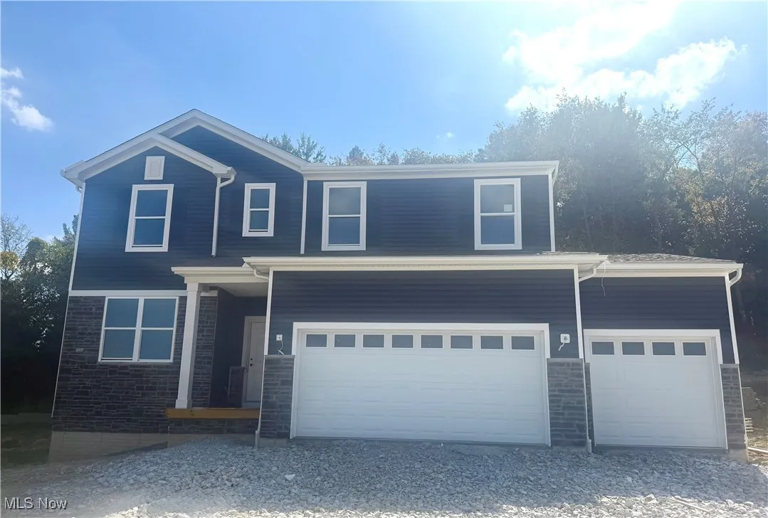 3-car garage and stone accents!  Home will be complete by the end of October.