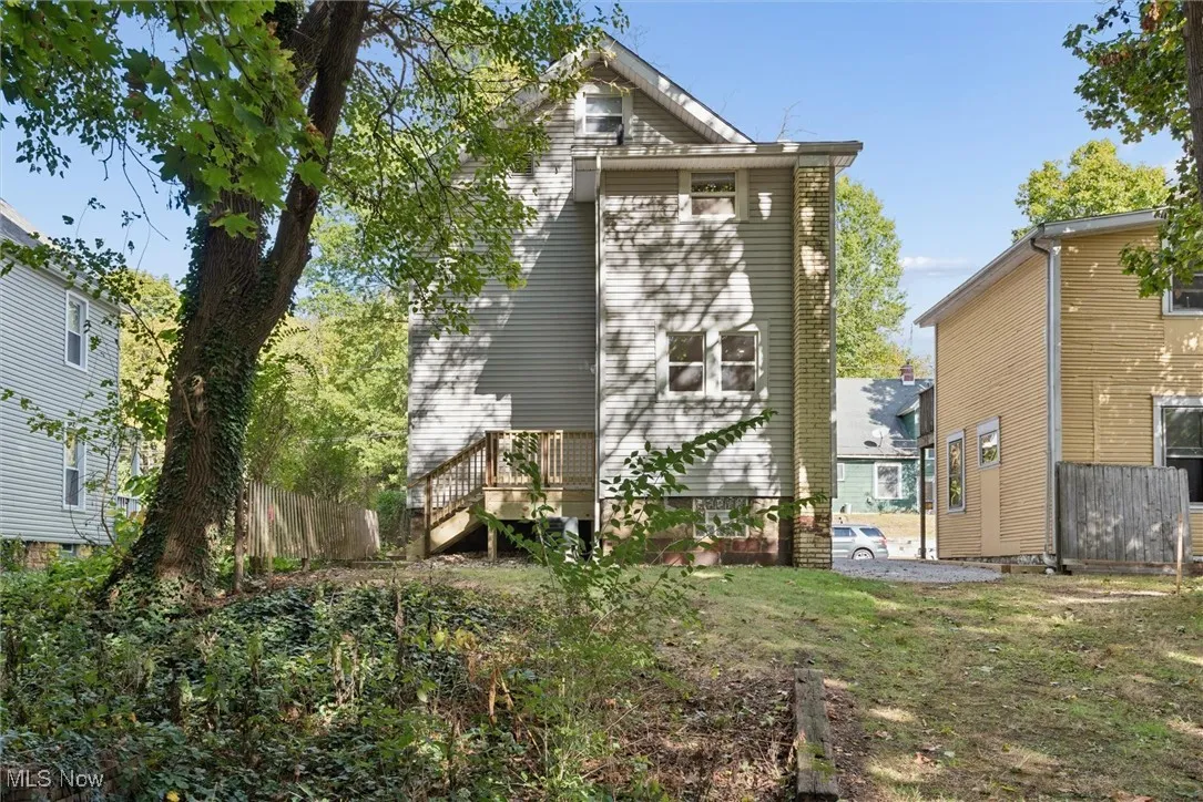 Rear view of house with a wooden deck