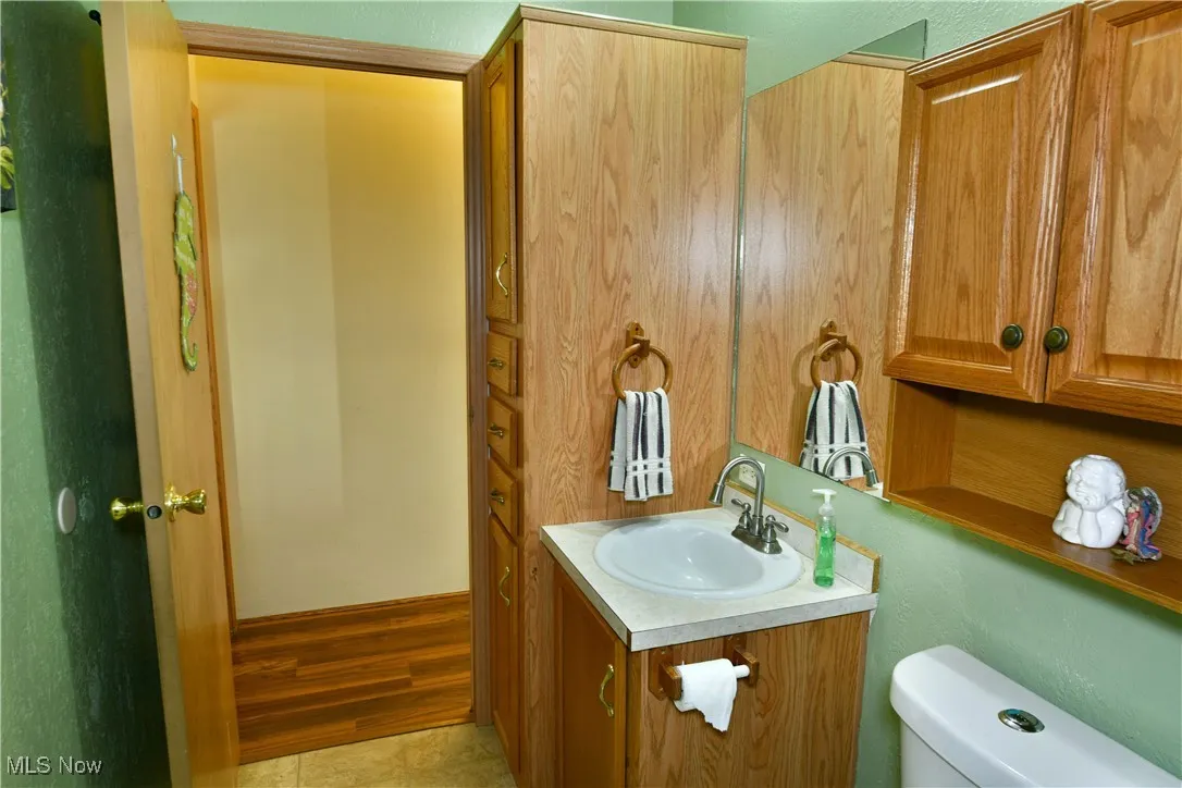 Bathroom with vanity and light wood finished floors