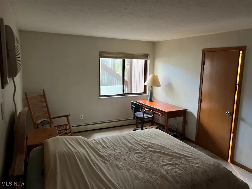 Another view of the primary bedroom