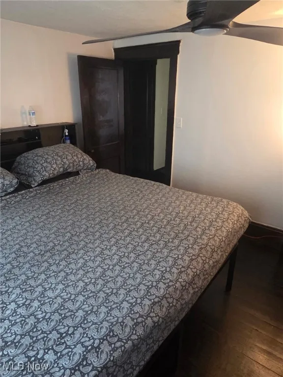 Bedroom featuring dark wood-style flooring