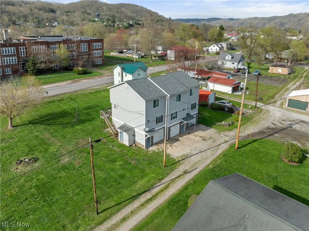 Aerial view of residential area featuring a mountainous background