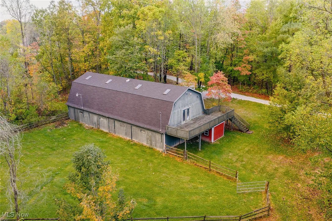 View from above of property with a heavily wooded area