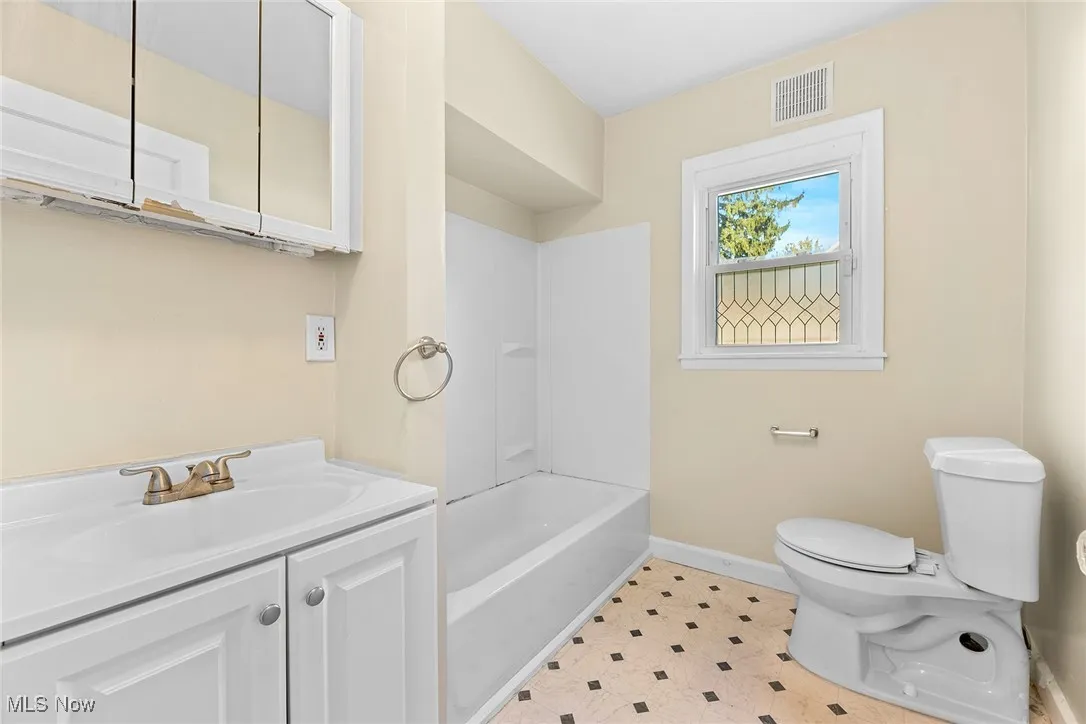 Full bath with vanity and shower / bathtub combination